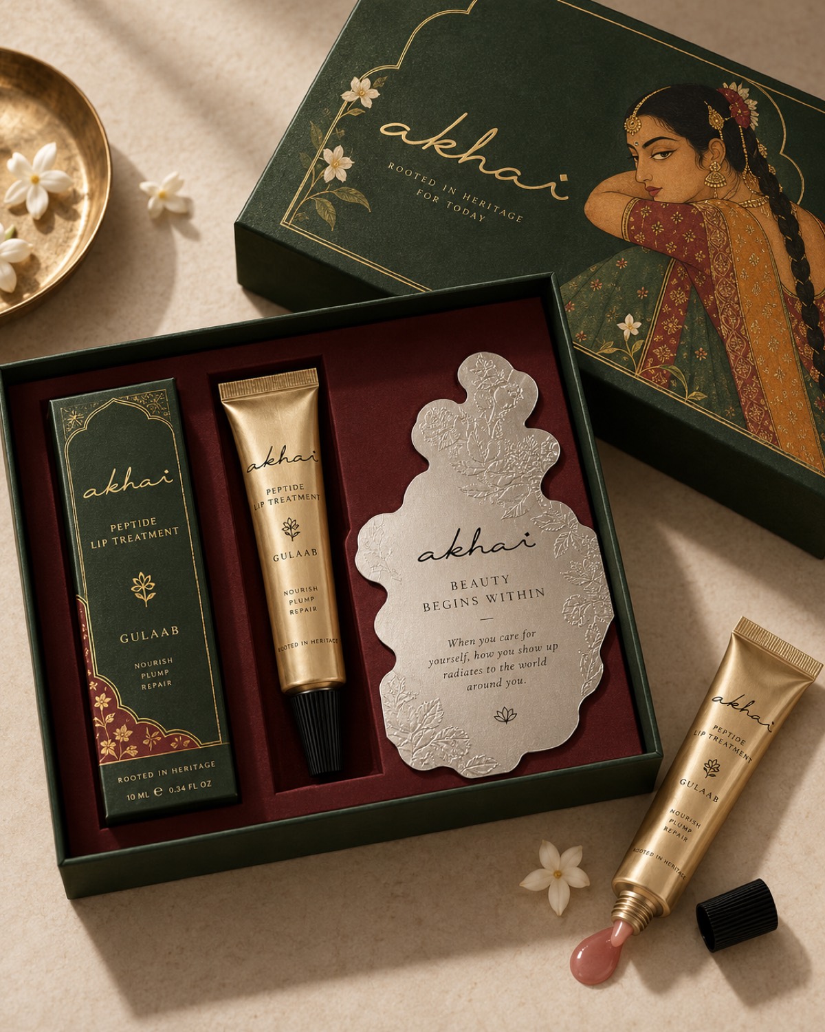 An Akhai gift set, gold tubes in a printed box