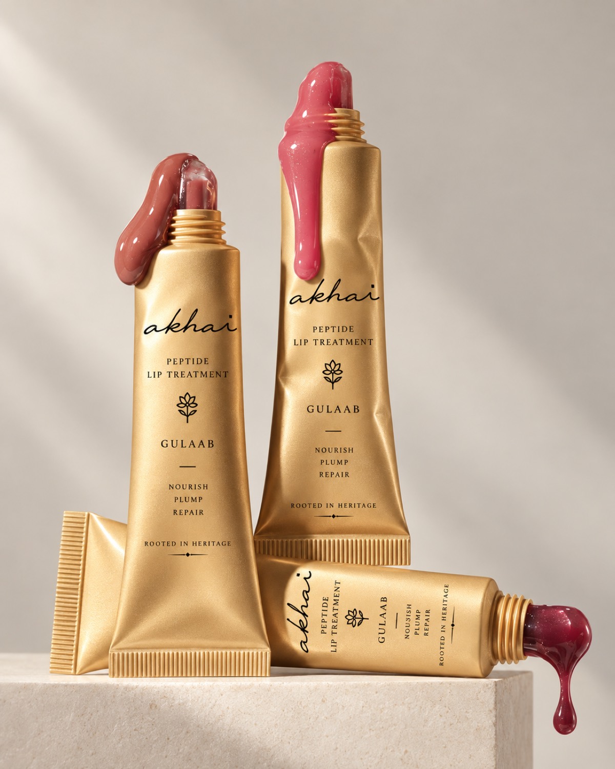 The Akhai gold lip treatment trio