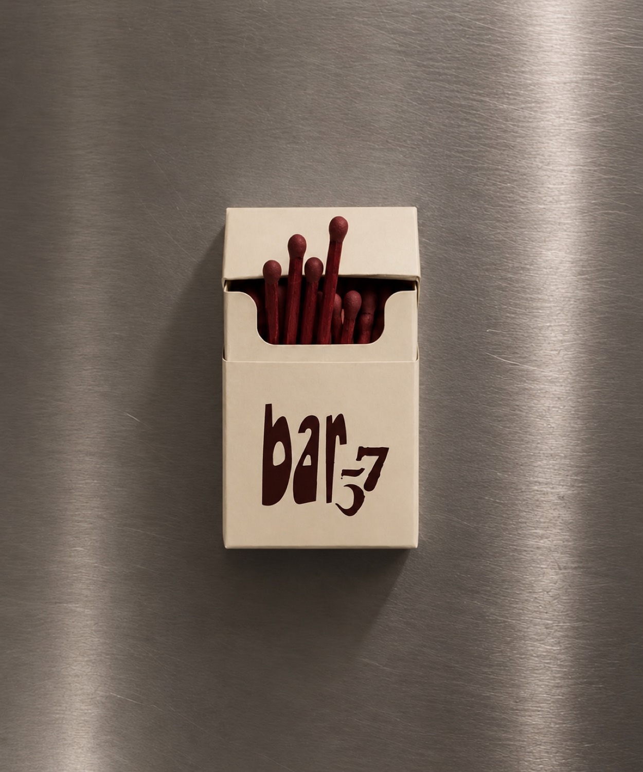 A Bar 57 matchbox on brushed steel