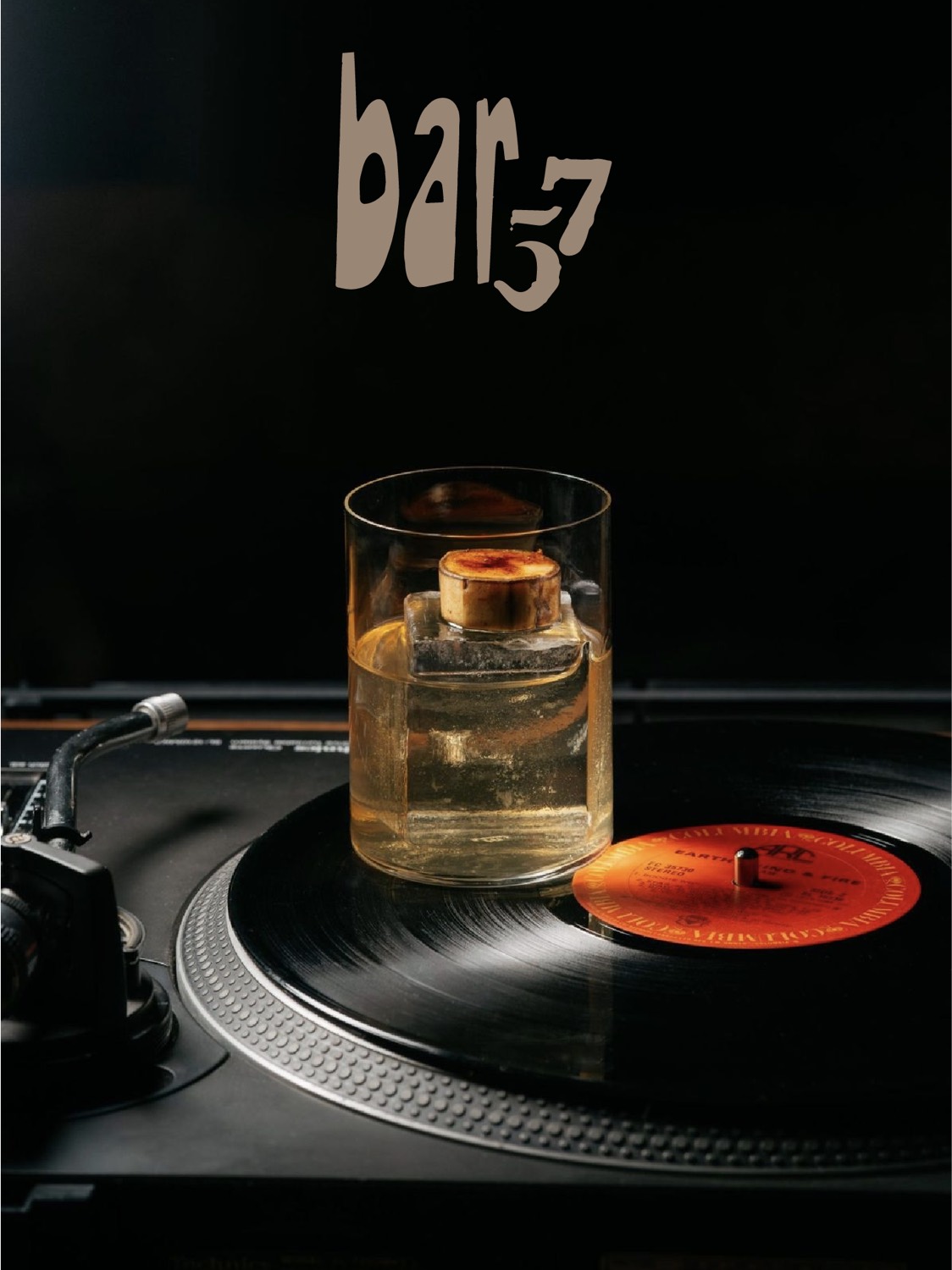 A Bar 57 cocktail resting on a turntable