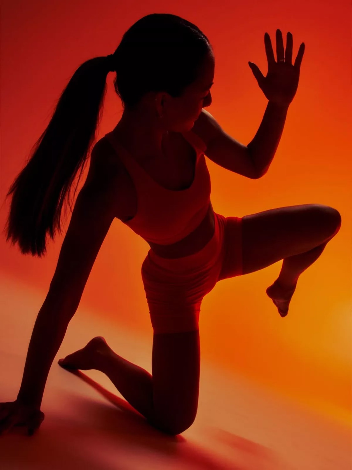 Siren campaign image, a figure lit in warm orange